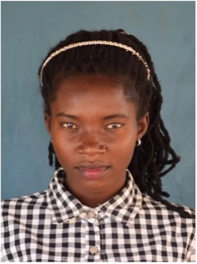 A student smiling after graduating from ECU